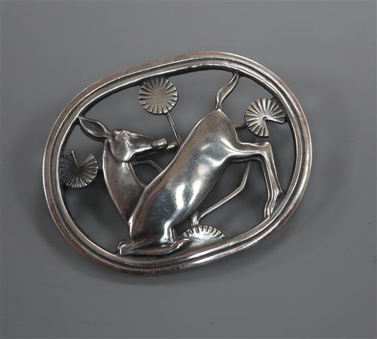 A Danish Georg Jensen sterling kneeling deer oval brooch, no. 256, 43mm.